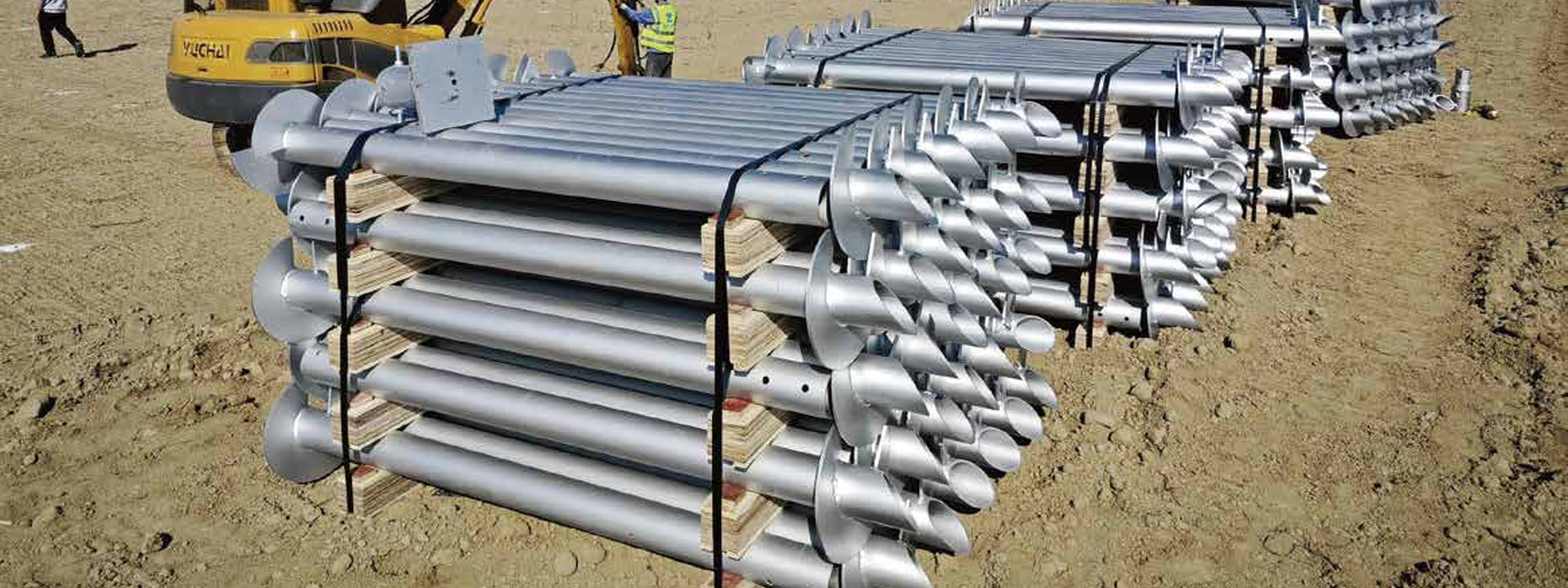 Helical pile installation with auger drive and monitoring